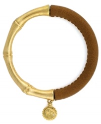 One part Zen and one part colorblock equals two parts fabulous! Jessica Simpson's totally-chic bangle features a serene bamboo setting in gold tone mixed metal combined with stretchable brown polyurethane. Approximate length (when stretched): 10 inches. One part Zen and one part colorblock equals two parts fabulous! Jessica Simpson's totally-chic bangle features a serene bamboo setting in gold tone mixed metal combined with stretchable brown polyurethane. Approximate length (when stretched): 10 inches.