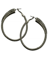 Gray matters on these sparkling clutchless hoops from GUESS. Pave crystals adorn a classic earring silhouette. Crafted in hematite tone mixed metal. Approximate drop: 2-1/4 inches. Gray matters on these sparkling clutchless hoops from GUESS. Pave crystals adorn a classic earring silhouette. Crafted in hematite tone mixed metal. Approximate drop: 2-1/4 inches.