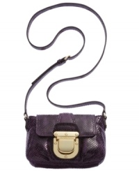 Reach for this reptilian print design from MICHAEL Michael Kors and delight in its diva-worthy style. Sumptuous leather is adorned with signature golden hardware, while the compact interior discretely stows your daily essentials. Reach for this reptilian print design from MICHAEL Michael Kors and delight in its diva-worthy style. Sumptuous leather is adorned with signature golden hardware, while the compact interior discretely stows your daily essentials.