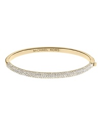 The charm of this thin Michael Kors bangle is all in the details--from the pave crusted front piece to the interior logo inscription. The charm of this thin Michael Kors bangle is all in the details--from the pave crusted front piece to the interior logo inscription.