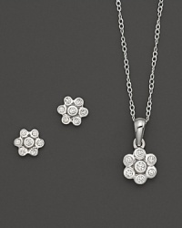 Young and glamorous: Mini diamond flower earrings and pendant necklace in white gold. Young and glamorous: Mini diamond flower earrings and pendant necklace in white gold.
