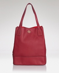 Tory Burch's uptown style shines by day with this tote. Crafted of leather and sized to take anywhere (and carry everything,) this must-have is oh so ready to carry on. Tory Burch's uptown style shines by day with this tote. Crafted of leather and sized to take anywhere (and carry everything,) this must-have is oh so ready to carry on.