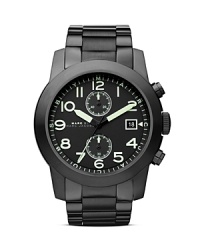 A coolly commanding choice, this MARC BY MARC JACOBS plated metal watch works a military-inspired vibe, defined by a two-eye chronograph and polished stainless steel bracelet. A coolly commanding choice, this MARC BY MARC JACOBS plated metal watch works a military-inspired vibe, defined by a two-eye chronograph and polished stainless steel bracelet.