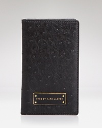Take MARC BY MARC JACOBS' enviable style with you when you go with this travel wallet, boasting a polished look and plenty of pockets for your first class essentials. Take MARC BY MARC JACOBS' enviable style with you when you go with this travel wallet, boasting a polished look and plenty of pockets for your first class essentials.
