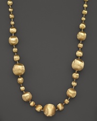 Graduated, hand-engraved 18K yellow gold bead necklace from Marco Bicego. Graduated, hand-engraved 18K yellow gold bead necklace from Marco Bicego.