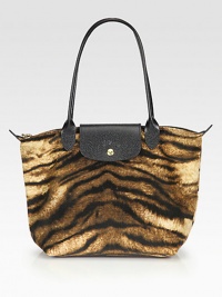An exotic, animal printed velvet cotton style with leather accents, perfect for travel or everyday.Double leather top handles, 4½ dropTop zip closure with snap button flapOne inside open pocketFully lined9¾W X 9¾H X 5½DImported An exotic, animal printed velvet cotton style with leather accents, perfect for travel or everyday.Double leather top handles, 4½ dropTop zip closure with snap button flapOne inside open pocketFully lined9¾W X 9¾H X 5½DImported