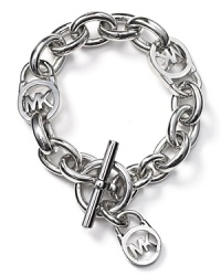 Go chunky-chic with Michael Kors' boldly sized chain bracelet. Work or weekend, slip on this silvery style to give your cuff sartorial weight. Go chunky-chic with Michael Kors' boldly sized chain bracelet. Work or weekend, slip on this silvery style to give your cuff sartorial weight.