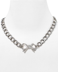 Juicy Couture puts a ladylike spin on their cult favorite starter necklace with a pavé bow pendant. Juicy Couture puts a ladylike spin on their cult favorite starter necklace with a pavé bow pendant.