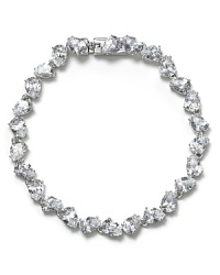 As easy to wear as it is elegant, this Nadri bracelet traces the wrist in glittering crystals, set off by rhodium plated metal. As easy to wear as it is elegant, this Nadri bracelet traces the wrist in glittering crystals, set off by rhodium plated metal.