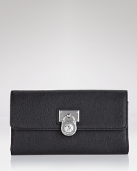 A logo-stamped lock detail adds edgy appeal to this polished leather wallet. By MICHAEL Michael Kors. A logo-stamped lock detail adds edgy appeal to this polished leather wallet. By MICHAEL Michael Kors.
