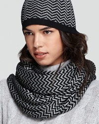 Glittering threads zig-zag across this statement-making loop scarf from Aqua. Glittering threads zig-zag across this statement-making loop scarf from Aqua.