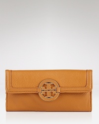 This Tory Burch wallet encapsulates polished ease, finished with a leather-inlaid logo medallion. Its well-organized tri-fold interior features a zip pocket and twelve credit card slots. This Tory Burch wallet encapsulates polished ease, finished with a leather-inlaid logo medallion. Its well-organized tri-fold interior features a zip pocket and twelve credit card slots.