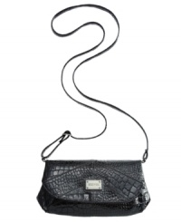Petite and posh, this sweet silhouette from Kenneth Cole Reaction is dressed for an afternoon out of town or an evening in the city. Done up in an edgy croc-embossed pattern with sleek signature detailing, it's perfect for stashing phone, cards, cash and fave lip gloss. Petite and posh, this sweet silhouette from Kenneth Cole Reaction is dressed for an afternoon out of town or an evening in the city. Done up in an edgy croc-embossed pattern with sleek signature detailing, it's perfect for stashing phone, cards, cash and fave lip gloss.