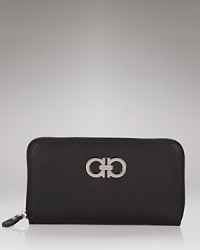 Polished and practical. Salvatore Ferragamo's logo-trimmed leather wallet is a rich spot to stow your cash, cards and coins. Polished and practical. Salvatore Ferragamo's logo-trimmed leather wallet is a rich spot to stow your cash, cards and coins.