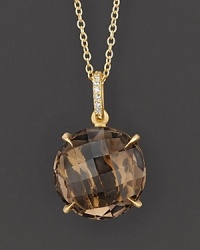 Pavé diamonds and smoky quartz sparkle in a 18K yellow gold setting. Pavé diamonds and smoky quartz sparkle in a 18K yellow gold setting.