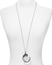 A bold plated silver and gunmetal tone pendant hangs from a simply styled link chain on this Rebecca Minkoff pendant necklace. Wear it as an architectural statement. A bold plated silver and gunmetal tone pendant hangs from a simply styled link chain on this Rebecca Minkoff pendant necklace. Wear it as an architectural statement.