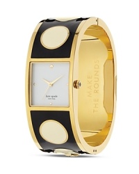 Just the ticket. This kate spade new york bangle watch takes its cues from the jewel box, crafted of plated metal and decked in playful graphic dots. Just the ticket. This kate spade new york bangle watch takes its cues from the jewel box, crafted of plated metal and decked in playful graphic dots.