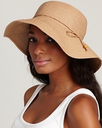 Exuded elegance in a natural floppy hat with woven tie trim. Exuded elegance in a natural floppy hat with woven tie trim.