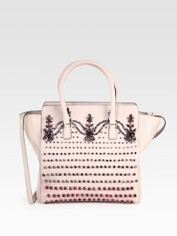 Rows of sparkling crystals adorn this lady-like silhouette of ultra-rich leather. Double top handles, 5 dropDetachable shoulder strap, 17 dropTop zip closureProtective metal feetOne inside zip pocketTwo inside open pocketsCotton lining16W X 11H X 4DMade in Italy Rows of sparkling crystals adorn this lady-like silhouette of ultra-rich leather. Double top handles, 5 dropDetachable shoulder strap, 17 dropTop zip closureProtective metal feetOne inside zip pocketTwo inside open pocketsCotton lining16W X 11H X 4DMade in Italy