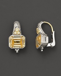 Sterling silver earrings set with faceted white sapphires and canary crystal. By Judith Ripka. Sterling silver earrings set with faceted white sapphires and canary crystal. By Judith Ripka.