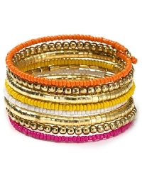 Nail this season's eclectic jewelry trend with beaded coil bracelet from Aqua. Decorated with layers of multi colored beads this colorful piece will work just as well for day as for night. Nail this season's eclectic jewelry trend with beaded coil bracelet from Aqua. Decorated with layers of multi colored beads this colorful piece will work just as well for day as for night.