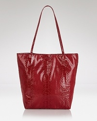 Sleek and chic, but still spacious enough for the essentials. Carlos Falchi's embossed micro-fiber tote is the definitive daytime carryall. Sleek and chic, but still spacious enough for the essentials. Carlos Falchi's embossed micro-fiber tote is the definitive daytime carryall.