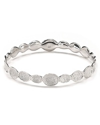 Textured 'pods' shine in silver plated brass in this infinity bangle from Melinda Maria. Textured 'pods' shine in silver plated brass in this infinity bangle from Melinda Maria.