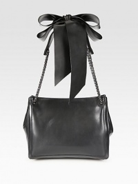 A refined shape of smooth leather, topped off with chain straps and a voluminous bow. Double chain and leather shoulder straps, 11¼ dropMagnetic snap closureOne inside zipper compartmentOne inside open pocketSignature red lining12W X 9¾H X 4¾DMade in Italy A refined shape of smooth leather, topped off with chain straps and a voluminous bow. Double chain and leather shoulder straps, 11¼ dropMagnetic snap closureOne inside zipper compartmentOne inside open pocketSignature red lining12W X 9¾H X 4¾DMade in Italy
