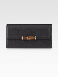 Continental wallet with bamboo detail in leather with light goldtone hardware.Snap closure Twelve card slots Two bill compartments Two separate interior compartments Zip coin pocket Fully lined 7½W X 4¼H X ½D Made in Italy Continental wallet with bamboo detail in leather with light goldtone hardware.Snap closure Twelve card slots Two bill compartments Two separate interior compartments Zip coin pocket Fully lined 7½W X 4¼H X ½D Made in Italy