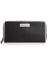 Get organized in the most elegant way with this luxe leather wallet from Calvin Klein. Crafted from supple leather and accented with signature detailing, it flaunts multiple pockets for effortless go-everywhere accessorizing. Get organized in the most elegant way with this luxe leather wallet from Calvin Klein. Crafted from supple leather and accented with signature detailing, it flaunts multiple pockets for effortless go-everywhere accessorizing.