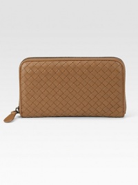 Richly woven leather keeps you stylishly organized. Zip-around closure One center zip coin compartment, two billfold sections Eight credit card slots Leather lining 7¾L X 4½H X 1D Made in Italy Richly woven leather keeps you stylishly organized. Zip-around closure One center zip coin compartment, two billfold sections Eight credit card slots Leather lining 7¾L X 4½H X 1D Made in Italy