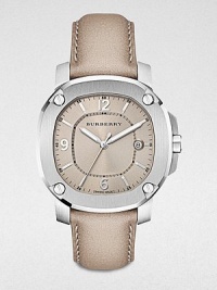 A classic timepiece with a brushed, grey stainless steel case and a luxurious leather strap. Quartz movementWater resistant to 5 ATMOctagonal stainless steel case, 38mm (1.5) Screw accented bezelNude dialBar and numeric hour markersDate display at 3 o'clockSecond hand Trench leather strapMade in Switzerland A classic timepiece with a brushed, grey stainless steel case and a luxurious leather strap. Quartz movementWater resistant to 5 ATMOctagonal stainless steel case, 38mm (1.5) Screw accented bezelNude dialBar and numeric hour markersDate display at 3 o'clockSecond hand Trench leather strapMade in Switzerland