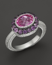 An sterling silver ring with faceted oval pink corundum stone and amethyst pave frame. By Judith Ripka. An sterling silver ring with faceted oval pink corundum stone and amethyst pave frame. By Judith Ripka.