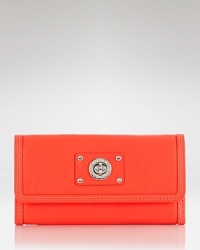 MARC BY MARC JACOBS perfects practical style with this leather wallet, accented by the label's signature turnlock. In a trend right hue, it's a haute piece of fashion hardware. MARC BY MARC JACOBS perfects practical style with this leather wallet, accented by the label's signature turnlock. In a trend right hue, it's a haute piece of fashion hardware.