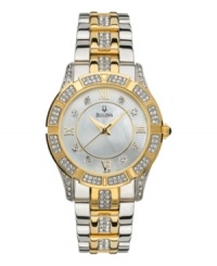 Enhance your wow factor with this glittering watch by Bulova. Two-tone stainless steel bracelet, round case, and bezel embellished with crystal accents. Mother-of-pearl dial features Roman numerals at markers, gold-tone hands and logo at twelve o'clock. Quartz movement. Water resistant to 30 meters. Three-year limited warranty Enhance your wow factor with this glittering watch by Bulova. Two-tone stainless steel bracelet, round case, and bezel embellished with crystal accents. Mother-of-pearl dial features Roman numerals at markers, gold-tone hands and logo at twelve o'clock. Quartz movement. Water resistant to 30 meters. Three-year limited warranty