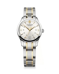 Inspired by classic military timepieces, this two-tone stainless steel watch is a commanding choice. Features like analog quartz movement, anti-reflective face and a date feature ensure this piece is as smart as it is sleek. Inspired by classic military timepieces, this two-tone stainless steel watch is a commanding choice. Features like analog quartz movement, anti-reflective face and a date feature ensure this piece is as smart as it is sleek.