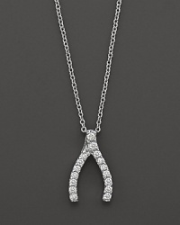 From the Tiny Treasures collection, a diamond wishbone necklace; with signature ruby accent. Designed by Roberto Coin. From the Tiny Treasures collection, a diamond wishbone necklace; with signature ruby accent. Designed by Roberto Coin.