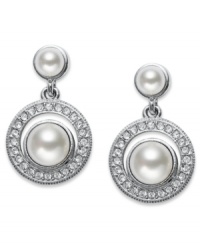 Polished perfection. A polished simulated pearl (6 mm) with genuine mother-of-pearl coating is adorned with round-cut crystal accents on Eliot Danori's elegant drop earrings. Set in rhodium-plated mixed metal. Approximate drop: 1/2 inch. Polished perfection. A polished simulated pearl (6 mm) with genuine mother-of-pearl coating is adorned with round-cut crystal accents on Eliot Danori's elegant drop earrings. Set in rhodium-plated mixed metal. Approximate drop: 1/2 inch.
