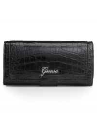 Give your look a glossy finish with the addition of croc-embossed patent. Shiny silvertone hardware and a logo detailed front keep this GUESS clutch both fashionable and functional. Give your look a glossy finish with the addition of croc-embossed patent. Shiny silvertone hardware and a logo detailed front keep this GUESS clutch both fashionable and functional.