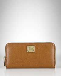 A slim and sleek zip-around wallet crafted in luxe textured leather from Lauren By Ralph Lauren. A slim and sleek zip-around wallet crafted in luxe textured leather from Lauren By Ralph Lauren.