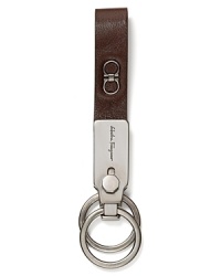 Adorned with Salvatore Ferragamo's signature Gancini logo, this keychain adds a bit of designer flair to your every day. Adorned with Salvatore Ferragamo's signature Gancini logo, this keychain adds a bit of designer flair to your every day.
