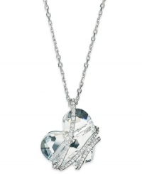 Fall in love with this pendant necklace from Swarovski. With a clear crystal heart wrapped in a crystal pave cage, this design becomes a romantic creation. Crafted in rhodium-plated mixed metal. Approximate length: 16 inches + 2-inch extender. Approximate drop: 1 inch. Fall in love with this pendant necklace from Swarovski. With a clear crystal heart wrapped in a crystal pave cage, this design becomes a romantic creation. Crafted in rhodium-plated mixed metal. Approximate length: 16 inches + 2-inch extender. Approximate drop: 1 inch.
