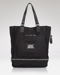 Day or night, get it right with this tote from Juicy Couture. It's all in the roomy silhouette and leather trims, which comes ready for anything in durable nylon. Day or night, get it right with this tote from Juicy Couture. It's all in the roomy silhouette and leather trims, which comes ready for anything in durable nylon.