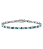 Polish and a pop of color. B. Brilliant's pretty tennis bracelet features alternating London blue cubic zirconias and clear cubic zirconias (5 ct. t.w.) set in sterling silver. Approximate length: 7-1/2 inches.