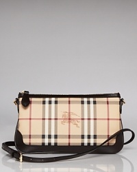 Wallet by day, clutch by night, this chic little Burberry wristlet is elegantly versatile. Wallet by day, clutch by night, this chic little Burberry wristlet is elegantly versatile.