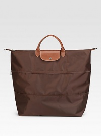 Versatile and stylish, this expandable bag with tonal zippers on the body includes a detachable shoulder strap and soft leather trim. Double handles, 4¼ drop Detachable shoulder strap, 13½ drop Top zipper and snap flap closures Inside open pocket Fully lined Polyamide canvas/leather trim 24W X 20½H X 9D Imported Versatile and stylish, this expandable bag with tonal zippers on the body includes a detachable shoulder strap and soft leather trim. Double handles, 4¼ drop Detachable shoulder strap, 13½ drop Top zipper and snap flap closures Inside open pocket Fully lined Polyamide canvas/leather trim 24W X 20½H X 9D Imported