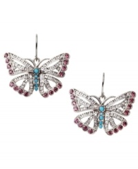 Frame your face with a little flutter. Fossil's free-spirited butterfly earrings combine purple and clear-colored crystal accents with reconstituted turquoise for color and shine. Set in silver tone mixed metal. Approximate drop: 1 inch. Frame your face with a little flutter. Fossil's free-spirited butterfly earrings combine purple and clear-colored crystal accents with reconstituted turquoise for color and shine. Set in silver tone mixed metal. Approximate drop: 1 inch.