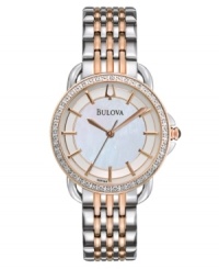 Classic Bulova elegance with contemporary eye-catching appeal. Watch crafted of two-tone stainless steel bracelet and round case. Bezel embellished with 24 diamond accents. Mother-of-pearl dial features applied rose-gold tone stick indices, three hands and logo. Quartz movement. Water resistant to 30 meters. Three-year limited warranty. Classic Bulova elegance with contemporary eye-catching appeal. Watch crafted of two-tone stainless steel bracelet and round case. Bezel embellished with 24 diamond accents. Mother-of-pearl dial features applied rose-gold tone stick indices, three hands and logo. Quartz movement. Water resistant to 30 meters. Three-year limited warranty.