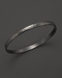 This textured 24K gold and dark silver bracelet makes a subtle, sophisticated statement. This textured 24K gold and dark silver bracelet makes a subtle, sophisticated statement.