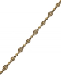 Alluring topaz color lends style to this Charter Club bracelet. The linked design highlights glass stones and medallions. Crafted in gold tone mixed metal. Approximate length: 7-1/2 inches. Alluring topaz color lends style to this Charter Club bracelet. The linked design highlights glass stones and medallions. Crafted in gold tone mixed metal. Approximate length: 7-1/2 inches.